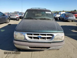 1996 Ford Explorer XL z VIN 1FMDU34X0TUC31973, wystawiony jako Copart lot #87892655 z przebiegiem 142 774 mil mil oraz Tytuł czysty. Historia ofert i sprzedaży dostępna na DreamBid. Obrazek 5.