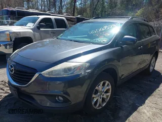 2015 Mazda CX-9 Touring with VIN JM3TB3CV1F0461854, listed as a IAAI auction lot 42068299 with 128,124 mi miles. Bid and sale history available at carsss.com. Image 2.