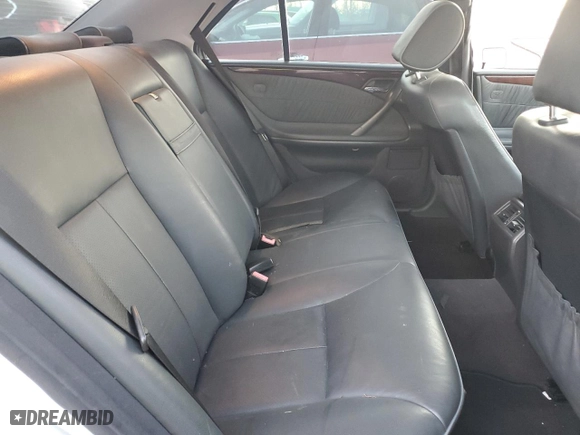 2000 Mercedes-Benz E-Class with VIN WDBJF70J7YB049473, listed as a Copart auction lot 82396624 with 197,515 mi miles and Salvage Title. Bid and sale history available at carsss.com. Image 10.