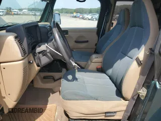 1999 Jeep Wrangler Sahara z VIN 1J4FY49S0XP453920, wystawiony jako Copart lot #61808475 z przebiegiem 129 062 mil mil oraz Czysty tytuł • Clean title. Historia ofert i sprzedaży dostępna na DreamBid. Obrazek 7.