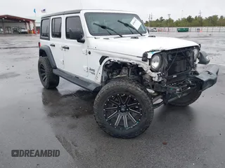 2019 Jeep Wrangler Unlimited Sport Altitude with VIN 1C4HJXDG3KW528647, listed as a IAAI auction lot 40986538 with 85,381 mi miles and . Bid and sale history available at DreamBid. Image 1.