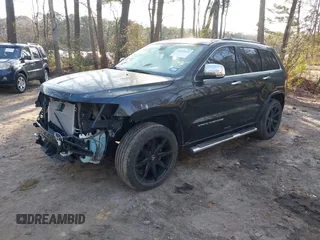 2015 Jeep Grand Cherokee Overland with VIN 1C4RJECGXFC957530, listed as a IAAI auction lot 41633522 with 168,258 mi miles and . Bid and sale history available at DreamBid. Image 2.