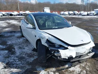 2023 Tesla Model 3 Long Range with VIN 5YJ3E1EBXPF392818, listed as a IAAI auction lot 41346835 with 31,750 mi miles and . Bid and sale history available at DreamBid. Image 6.