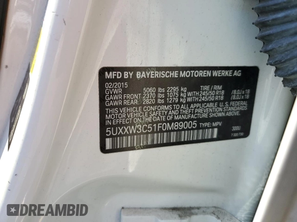 2015 BMW X4 xDrive28i with VIN 5UXXW3C51F0M89005, listed as a Copart auction lot 57392984 with 142,385 mi miles. Bid and sale history available at carsss.com. Image 13.