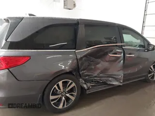 2021 Honda Odyssey Touring with VIN 5FNRL6H86MB026038, listed as a IAAI auction lot 41735249 with 68,480 mi miles. Bid and sale history available at carsss.com. Image 6.
