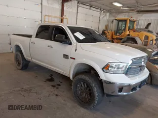 2015 Ram 1500 Laramie Limited with VIN 1C6RR7WM6FS678840, listed as a IAAI auction lot 42040449 with Not provided miles and . Bid and sale history available at DreamBid. Image 1.