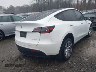 2021 Tesla Model Y Long Range with VIN 5YJYGDEEXMF228914, listed as a IAAI auction lot 41409806 with 48,276 mi miles. Bid and sale history available at carsss.com. Image 4.