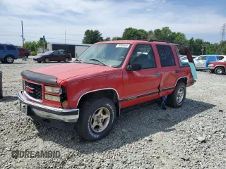 1999 GMC Yukon with VIN 1GKEK13R5XJ700234, listed as a Copart auction lot 55885584 with 163,129 mi miles and Salvage Title. Bid and sale history available at carsss.com. Image 1.