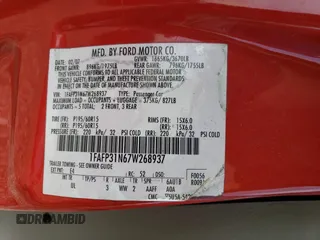 2007 Ford Focus S with VIN 1FAFP31N67W268937, listed as a Copart auction lot 43875925 with 141,786 mi miles and Salvage Title. Bid and sale history available at DreamBid. Image 13.