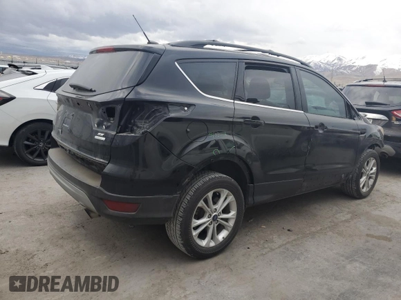 2017 Ford Escape SE with VIN 1FMCU0GD7HUE72044, listed as a Copart auction lot 48565255 with 125,052 mi miles and Salvage Title. Bid and sale history available at DreamBid. Image 3.