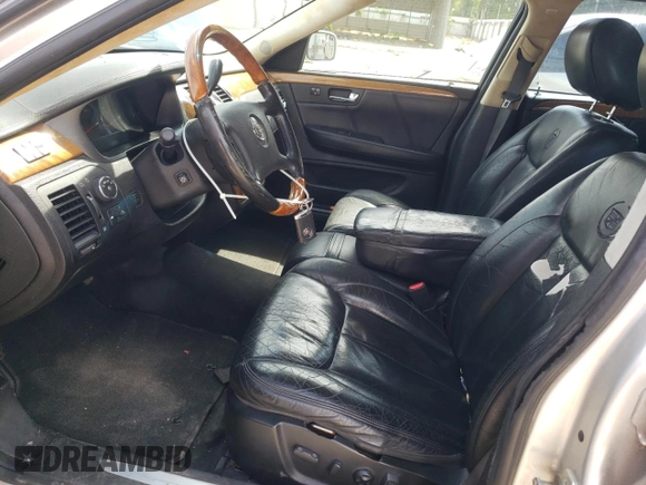 2009 Cadillac DTS 1SA z VIN 1G6KD57Y69U114700, wystawiony jako Copart lot #56007485 z przebiegiem 158 849 mil mil oraz Szkoda całkowita • Salvage title. Historia ofert i sprzedaży dostępna na DreamBid. Obrazek 7.