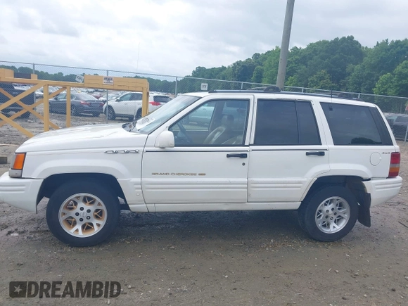 1996 Jeep Grand Cherokee Limited z VIN 1J4GZ78YXTC191527, wystawiony jako IAAI lot #42352616 z przebiegiem 325 927 mil mil oraz . Historia ofert i sprzedaży dostępna na DreamBid. Obrazek 15.