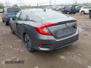 2017 Honda Civic EX-T with VIN 19XFC1F34HE014334, listed as a IAAI auction lot 42009311 with 124,717 mi miles. Bid and sale history available at carsss.com. Image 3.