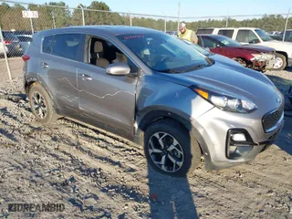 2021 Kia Sportage LX with VIN KNDPMCACXM7864757, listed as a IAAI auction lot 40740313 with 94,141 mi miles. Bid and sale history available at carsss.com. Image 1.