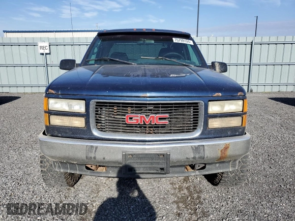 1995 GMC Sierra 1500 z VIN 2GTEK19K3S1591653, wystawiony jako Copart lot #75799124 z przebiegiem 329 311 mil mil oraz Nie do naprawy. Historia ofert i sprzedaży dostępna na DreamBid. Obrazek 5.
