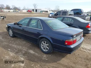 1999 Cadillac Seville Touring STS z VIN 1G6KY5493XU913994, wystawiony jako IAAI lot #41780695 z przebiegiem 60 375 mil mil oraz . Historia ofert i sprzedaży dostępna na DreamBid. Obrazek 3.