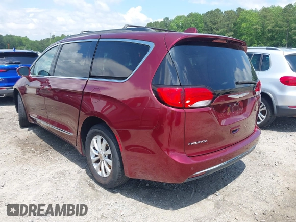 2017 Chrysler Pacifica Touring L with VIN 2C4RC1BG0HR591124, listed as a IAAI auction lot 42138595 with 113,071 mi miles and . Bid and sale history available at DreamBid. Image 3.