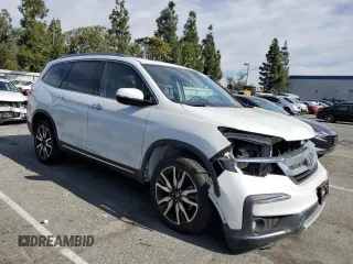 2021 Honda Pilot Elite with VIN 5FNYF6H02MB029791, listed as a Copart auction lot 42829435 with 54,403 mi miles and Salvage Title. Bid and sale history available at DreamBid. Image 4.