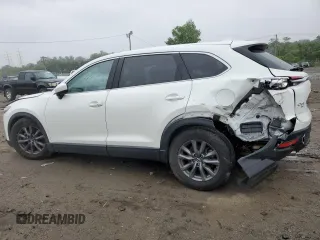 2021 Mazda CX-9 Touring with VIN JM3TCBCY1M0517709, listed as a Copart auction lot 57624945 with 64,081 mi miles and Salvage title. Bid and sale history available at DreamBid. Image 2.