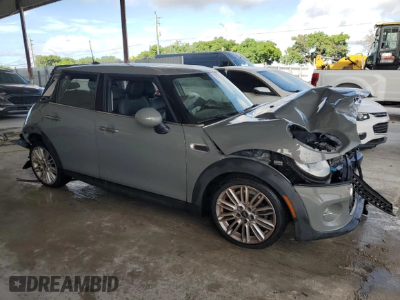 2018 MINI Hardtop 4 Door Cooper with VIN WMWXU1C55J2F79623, listed as a Copart auction lot 60515015 with Not provided miles and Salvage title. Bid and sale history available at DreamBid. Image 4.