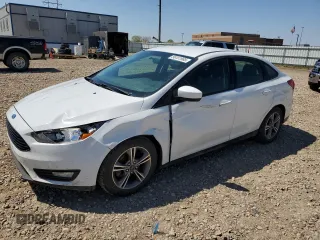 2018 Ford Focus SE with VIN 1FADP3FE0JL227146, listed as a Copart auction lot 56151985 with 124,517 mi miles and Salvage title. Bid and sale history available at DreamBid. Image 1.