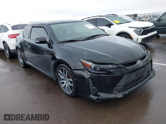 2015 Scion tC with VIN JTKJF5C79FJ003404, listed as a IAAI auction lot 41756024 with 128,906 mi miles. Bid and sale history available at carsss.com. Image 1.