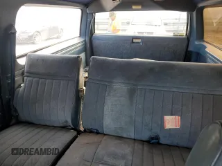 1988 GMC Suburban z VIN 1GKER16K5JF536794, wystawiony jako Copart lot #49308115 z przebiegiem 95 416 mil mil oraz Tytuł czysty. Historia ofert i sprzedaży dostępna na DreamBid. Obrazek 10.