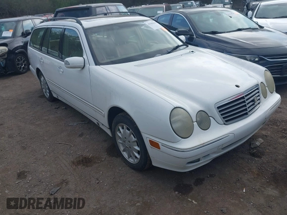 2001 Mercedes-Benz E-Class AWD with VIN WDBJH82J61X057506, listed as a IAAI auction lot 41506666 with 304,332 mi miles. Bid and sale history available at carsss.com. Image 1.