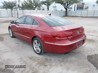 2014 Volkswagen CC Sport with VIN WVWBN7AN0EE527558, listed as a IAAI auction lot 41336204 with 130,005 mi miles and . Bid and sale history available at DreamBid. Image 3.