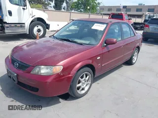 2002 Mazda Protege DX with VIN JM1BJ225621608984, listed as a IAAI auction lot 42106167 with 158,662 mi miles and . Bid and sale history available at DreamBid. Image 2.