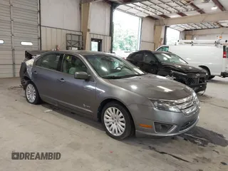 2012 Ford Fusion Hybrid z VIN 3FADP0L35CR181772, wystawiony jako IAAI lot #42451127 z przebiegiem 103 496 mil mil oraz . Historia ofert i sprzedaży dostępna na DreamBid. Obrazek 1.