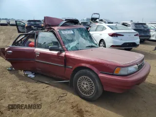 1989 Toyota Camry LE ECT z VIN JT2SV22E9K3372302, wystawiony jako Copart lot #68754144 z przebiegiem 341 387 mil mil oraz Nie do naprawy • Non repairable. Historia ofert i sprzedaży dostępna na DreamBid. Obrazek 4.