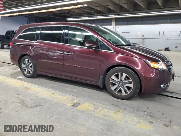 2014 Honda Odyssey Touring with VIN 5FNRL5H93EB079817, listed as a Copart auction lot 56231645 with 65,521 mi miles and Salvage title. Bid and sale history available at DreamBid. Image 4.
