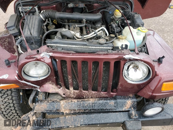 2002 Jeep Wrangler Sahara with VIN 1J4FA59S32P746410, listed as a Copart auction lot 56403075 with 147,968 mi miles and Salvage title. Bid and sale history available at DreamBid. Image 12.