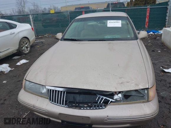1997 Lincoln Continental with VIN 1LNLM97V3VY666104, listed as a IAAI auction lot 41650904 with 181,536 mi miles. Bid and sale history available at carsss.com. Image 6.