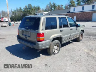 1997 Jeep Grand Cherokee Laredo with VIN 1J4GZ58S7VC713517, listed as a IAAI auction lot 42062214 with 205,533 mi miles. Bid and sale history available at carsss.com. Image 4.