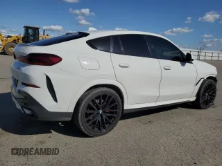 2023 BMW X6 xDrive40i z VIN 5UXCY6C04P9P49005, wystawiony jako Copart lot #51974695 z przebiegiem 30 421 mil mil oraz Szkoda całkowita • Salvage title. Historia ofert i sprzedaży dostępna na DreamBid. Obrazek 3.