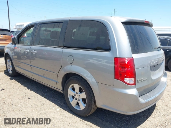 2013 Dodge Grand Caravan SE with VIN 2C4RDGBG0DR702913, listed as a IAAI auction lot 42007786 with 163,981 mi miles and . Bid and sale history available at DreamBid. Image 3.