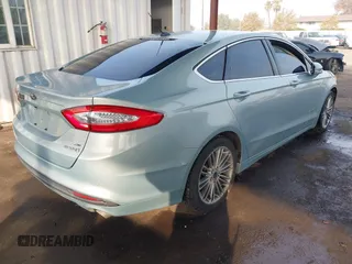 2014 Ford Fusion SE Hybrid with VIN 3FA6P0LU8ER283409, listed as a IAAI auction lot 40984629 with 206,605 mi miles. Bid and sale history available at carsss.com. Image 4.