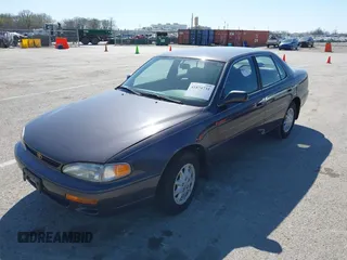 1996 Toyota Camry DX with VIN 4T1BG12K8TU915891, listed as a IAAI auction lot 41874731 with 57,564 mi miles. Bid and sale history available at carsss.com. Image 2.