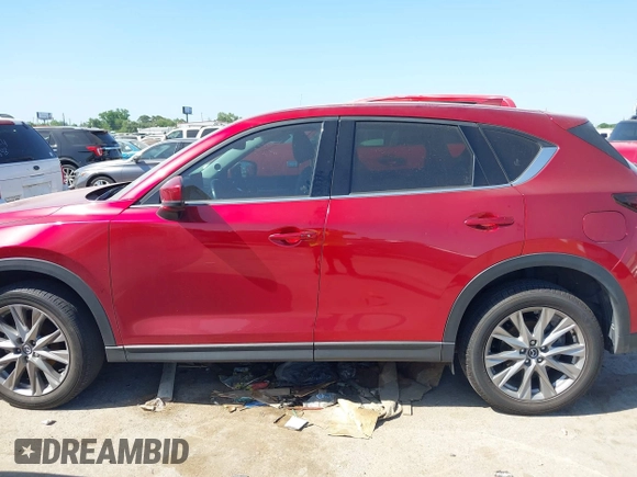 2021 Mazda CX-5 Grand Touring with VIN JM3KFADM4M0476615, listed as a IAAI auction lot 42004814 with 42,483 mi miles. Bid and sale history available at carsss.com. Image 14.