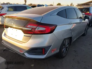 2018 Honda Clarity with VIN JHMZC5F15JC018312, listed as a IAAI auction lot 41354648 with 97,035 mi miles and . Bid and sale history available at DreamBid. Image 4.