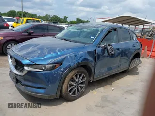 2018 Mazda CX-5 Touring z VIN JM3KFACM5J1442416, wystawiony jako IAAI lot #42093137 z przebiegiem 65 102 mil mil oraz . Historia ofert i sprzedaży dostępna na DreamBid. Obrazek 2.