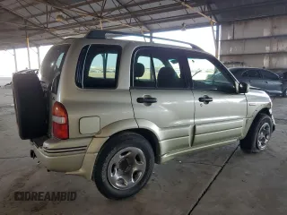 1999 Suzuki Grand Vitara LX z VIN JS3TD62V3X4123048, wystawiony jako Copart lot #73007124 z przebiegiem 159 828 mil mil oraz Szkoda całkowita • Salvage title. Historia ofert i sprzedaży dostępna na DreamBid. Obrazek 3.