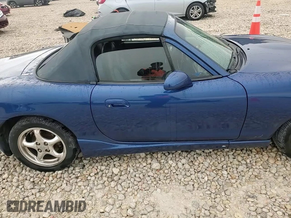 1999 Mazda MX-5 Miata with VIN JM1NB3532X0134801, listed as a Copart auction lot 83838374 with 97,015 mi miles and Salvage title. Bid and sale history available at DreamBid. Image 11.