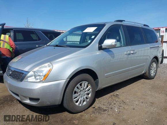 2012 Kia Sedona LX with VIN KNDMG4C70C6491703, listed as a IAAI auction lot 42128411 with 246,586 mi miles. Bid and sale history available at carsss.com. Image 2.