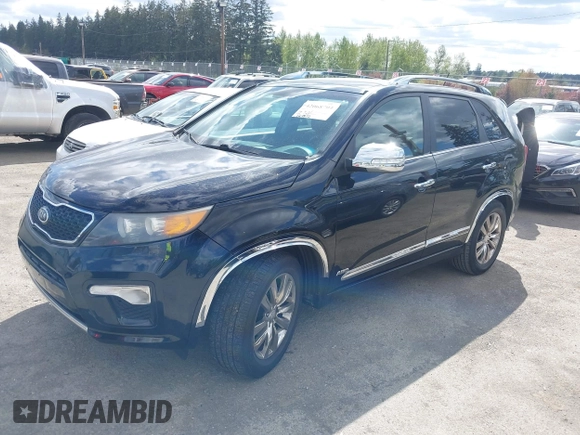 2012 Kia Sorento SX with VIN 5XYKWDA26CG258262, listed as a IAAI auction lot 42068704 with 124,832 mi miles. Bid and sale history available at carsss.com. Image 2.
