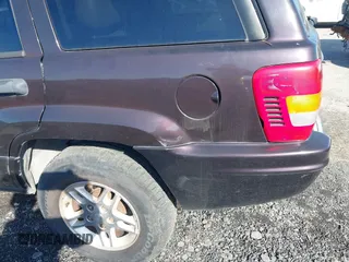 2004 Jeep Grand Cherokee with VIN 1J8GX48S24C266933, listed as a IAAI auction lot 41497122 with 200,899 mi miles and . Bid and sale history available at DreamBid. Image 6.