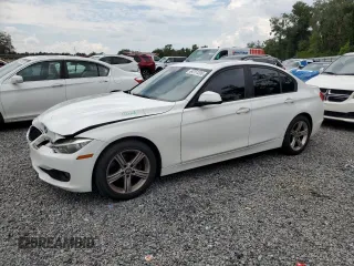 2013 BMW 3 Series 320i with VIN WBA3B1C56DK129906, listed as a Copart auction lot 64751205 with 184,825 mi miles and Salvage title. Bid and sale history available at DreamBid. Image 1.