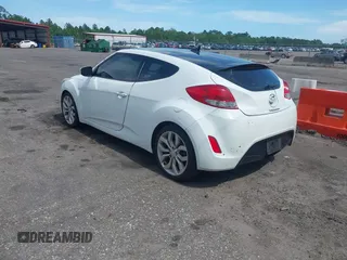2012 Hyundai Veloster w/Gray Int z VIN KMHTC6ADXCU050034, wystawiony jako IAAI lot #42506584 z przebiegiem 142 514 mil mil oraz . Historia ofert i sprzedaży dostępna na DreamBid. Obrazek 3.